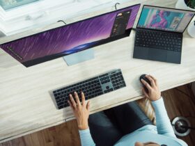 person using laptop on table