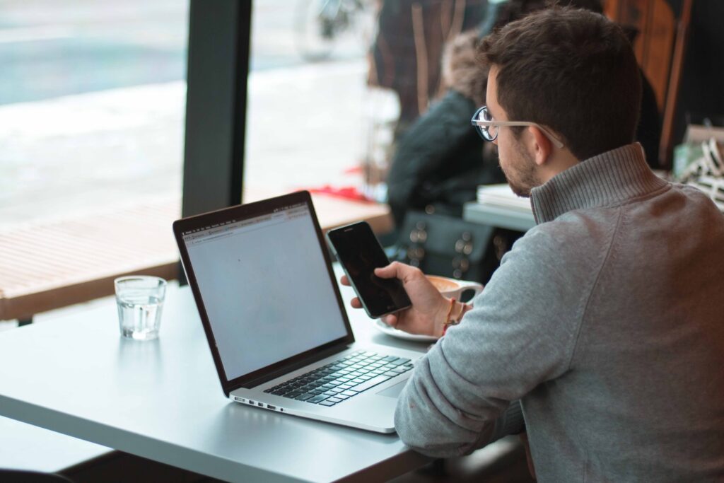 A man working on a laptop.