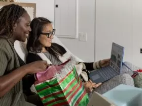 a woman looking at a laptop