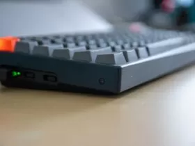 black computer keyboard on brown wooden table