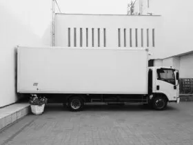 white truck parked near white building