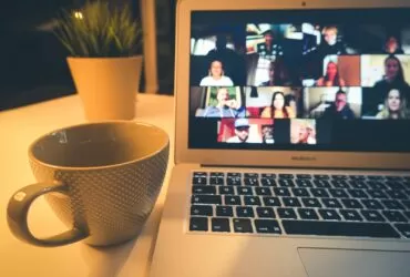 macbook air displaying woman in white shirt