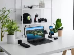 black laptop computer on white table