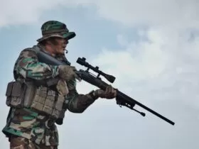 soldier holding sniper rifle standing