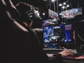 person sitting on gaming chair while playing video game