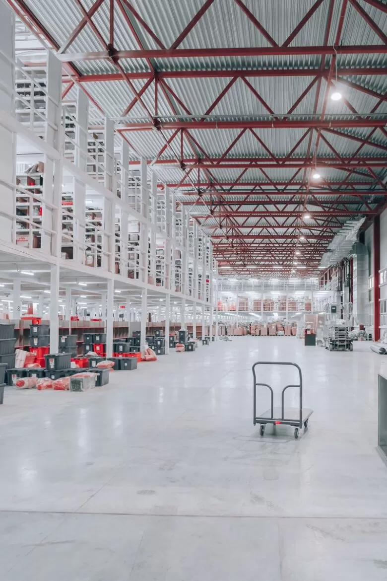 people sitting on red and white chairs inside building