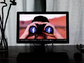 television showing man using binoculars