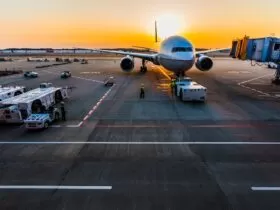 gray airplane on parking