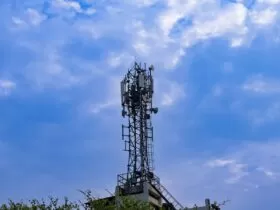 a tower with a cell phone on top of it