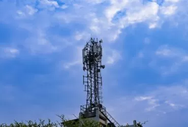 a tower with a cell phone on top of it