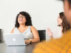 woman sitting in front of the laptop